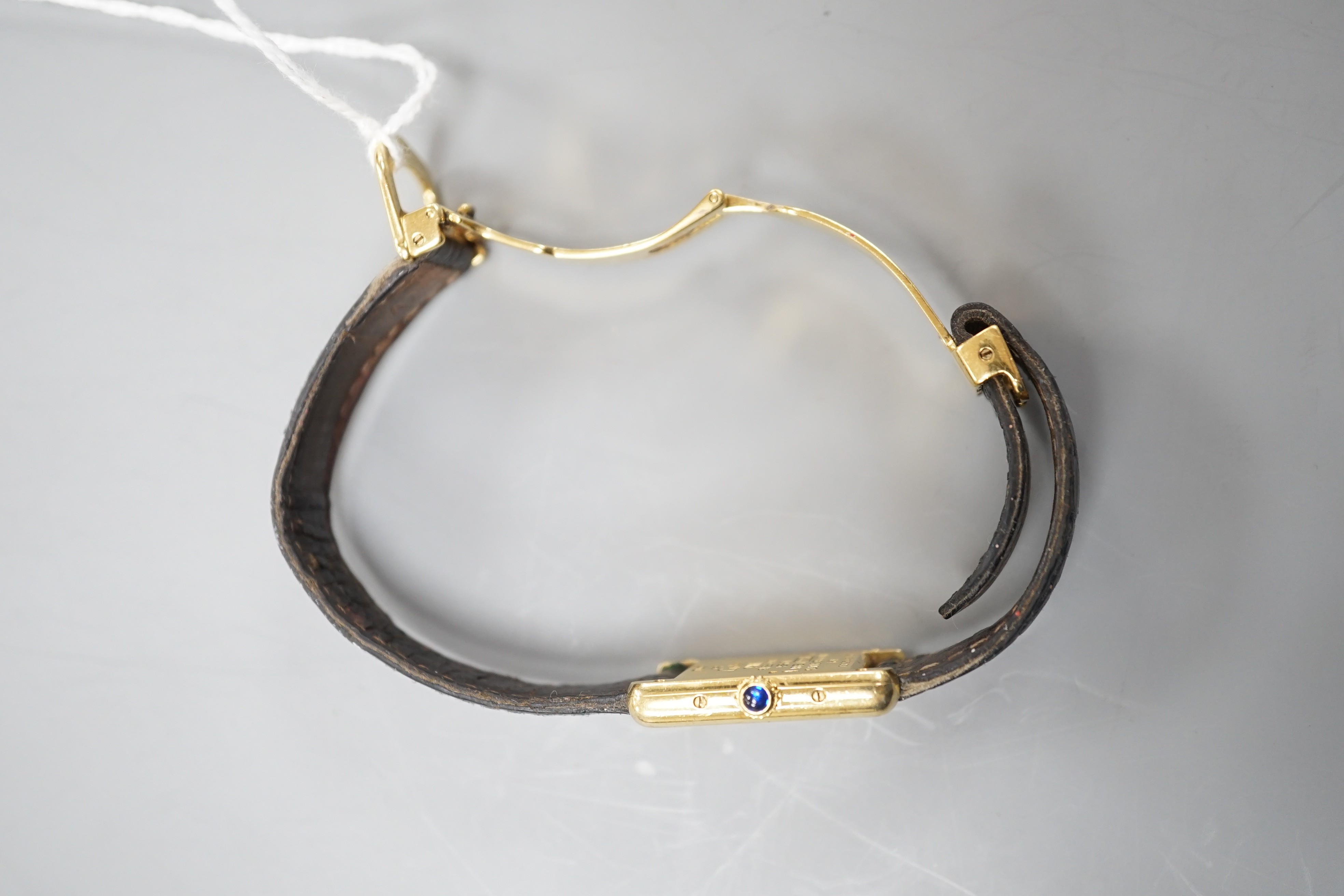 A lady's modern 925 gilt Must de Cartier rectangular quartz wrist watch, with three colour dial, on Cartier bracelet with gilt steel deployment clasp, no box or papers.